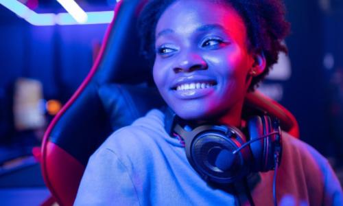 African gamer with earphones  